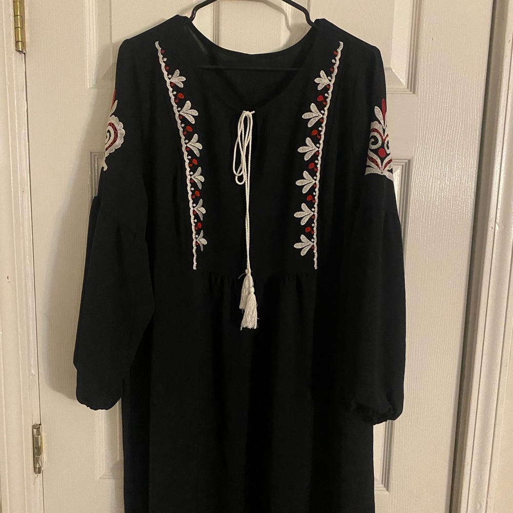 Black dress with embroidered pattern